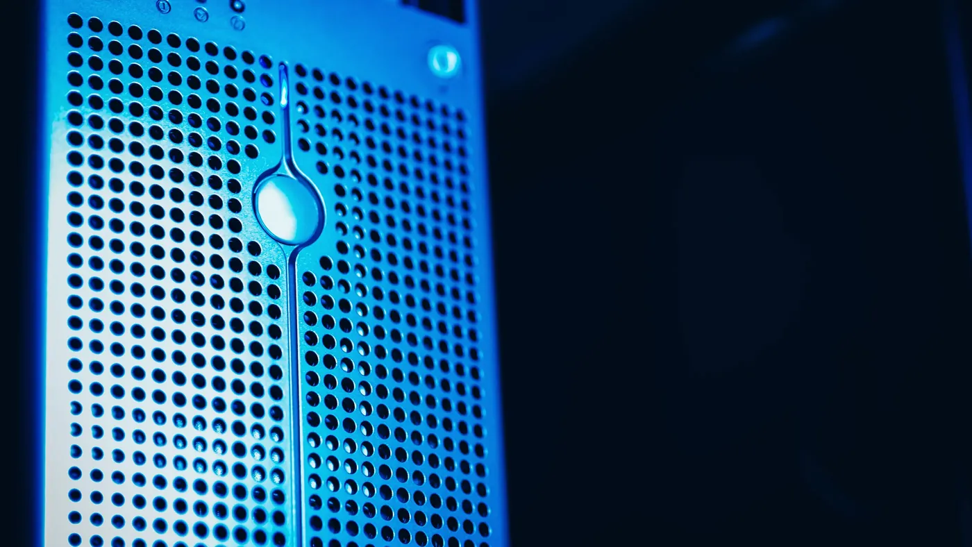 A blue-lit server rack in a data center
